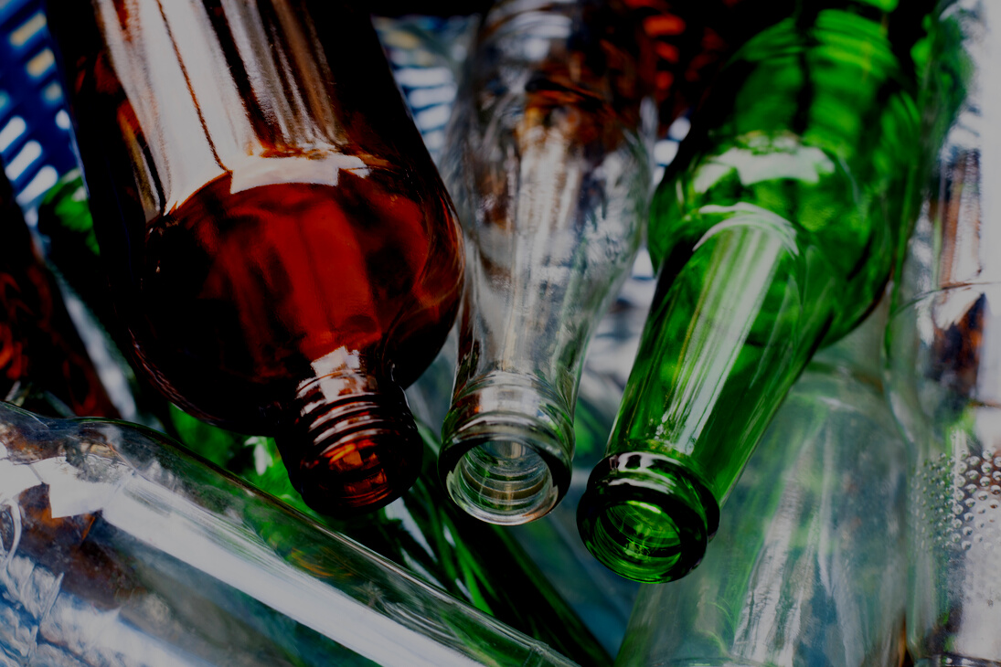 Glass bottles in waste basket.